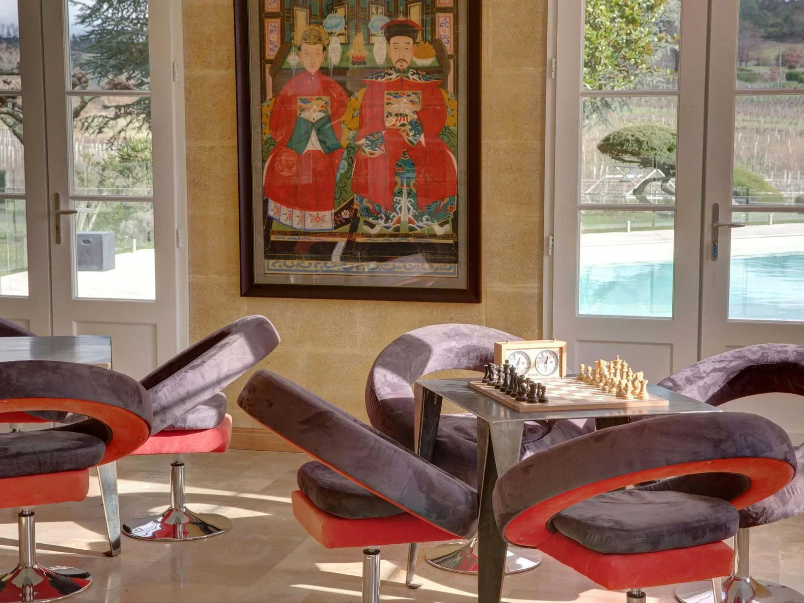 Armchairs and chess set in the games and music lounge at Palanquey